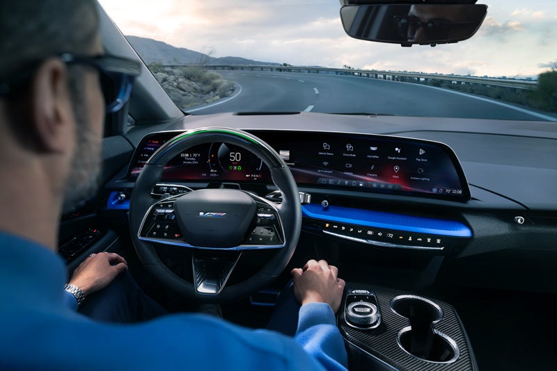 Front View of the 2026 OPTIQ-V Driving Through the Dusk Utilizing its Headlights | Horne Auto Center Inc in Show Low AZ